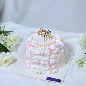 White & Pink Ribbon Cake Design